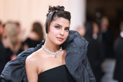 Priyanka Chopra Jonas at the 2023 met gala with her styled in updo tied with a bow