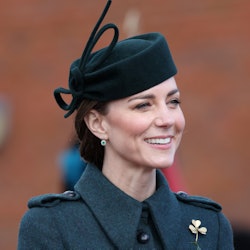 Kate Middleton wearing an forest green coat by Laura Green.