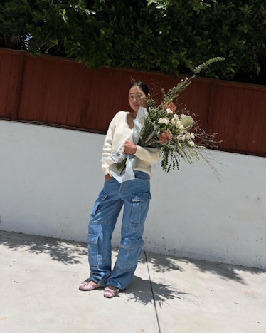 Aimee Song wears cargo jeans.