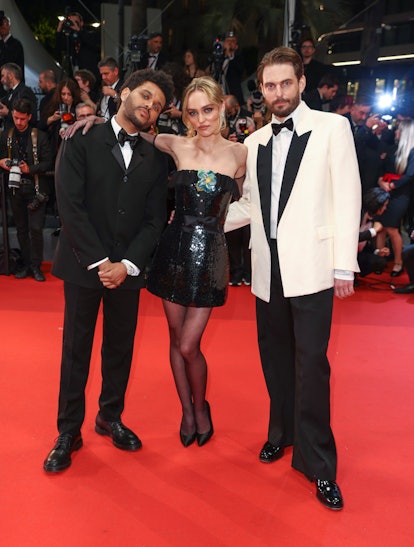 The Weeknd, Lily-Rose Depp, and Sam Levinson attend the "The Idol" red carpet during the 76th annual...