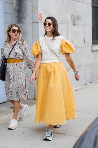 A guest wearing yellow dress at NYFW