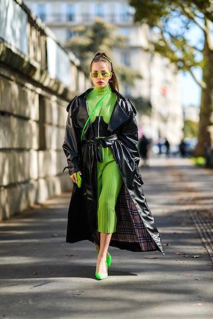 Kelly green turtleneck dress worn with underbust corset in street style 2021.