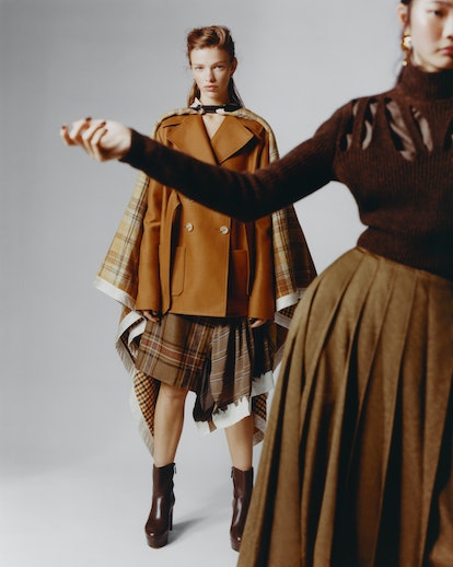 Models wearing Lanvin coats, skirt; Jennifer Fisher earrings; Stuart Weitzman boots. Fendi sweater, ...