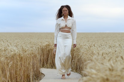 Model walks down Jacquemus runway wearing white