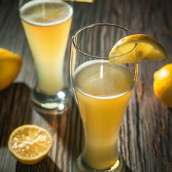 Two glasses of cold lemon radler beer, summer drink