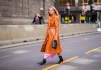 OSLO, NORWAY - AUGUST 14: Stephanie Broek wearing orange vinyl coat seen outside Epilogue during Osl...