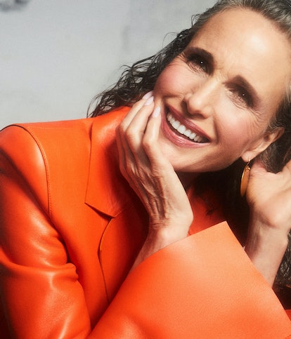 A portrait shot of TZR cover star Andie MacDowell with gray hair wearing an orange Off-White c/o Vir...