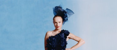 Kate Bosworth poses in the Oscar de la Renta dark blue gown and a matching headpiece.