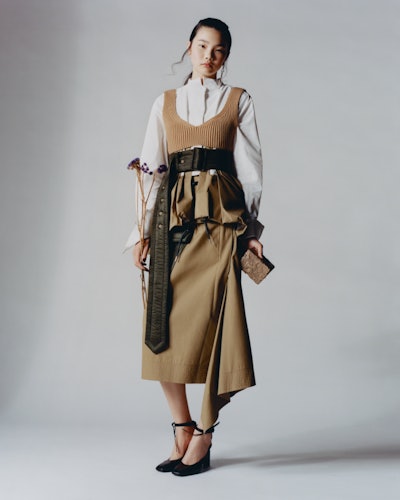 Model wearing No.21 knitted bra; Sacai shirt, skirt; Bjorg earrings; Nina Ricci mules.     