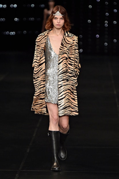 A model walking on the runway of the Saint Laurent Spring 2016 show