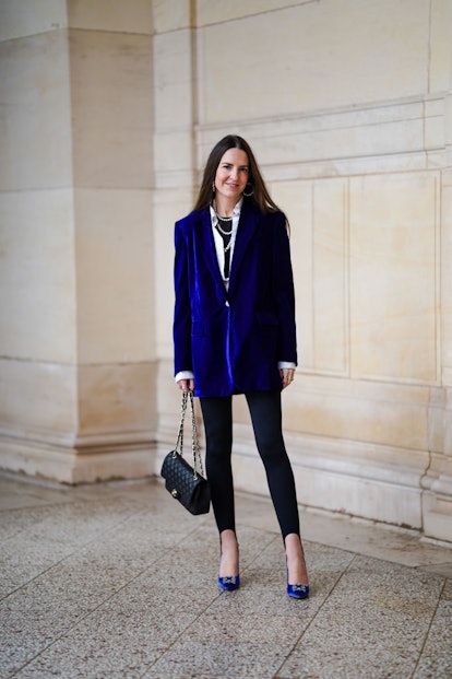 Alba Garavito Torre wears black stirrup leggings with velvet blazer and Chanel bag